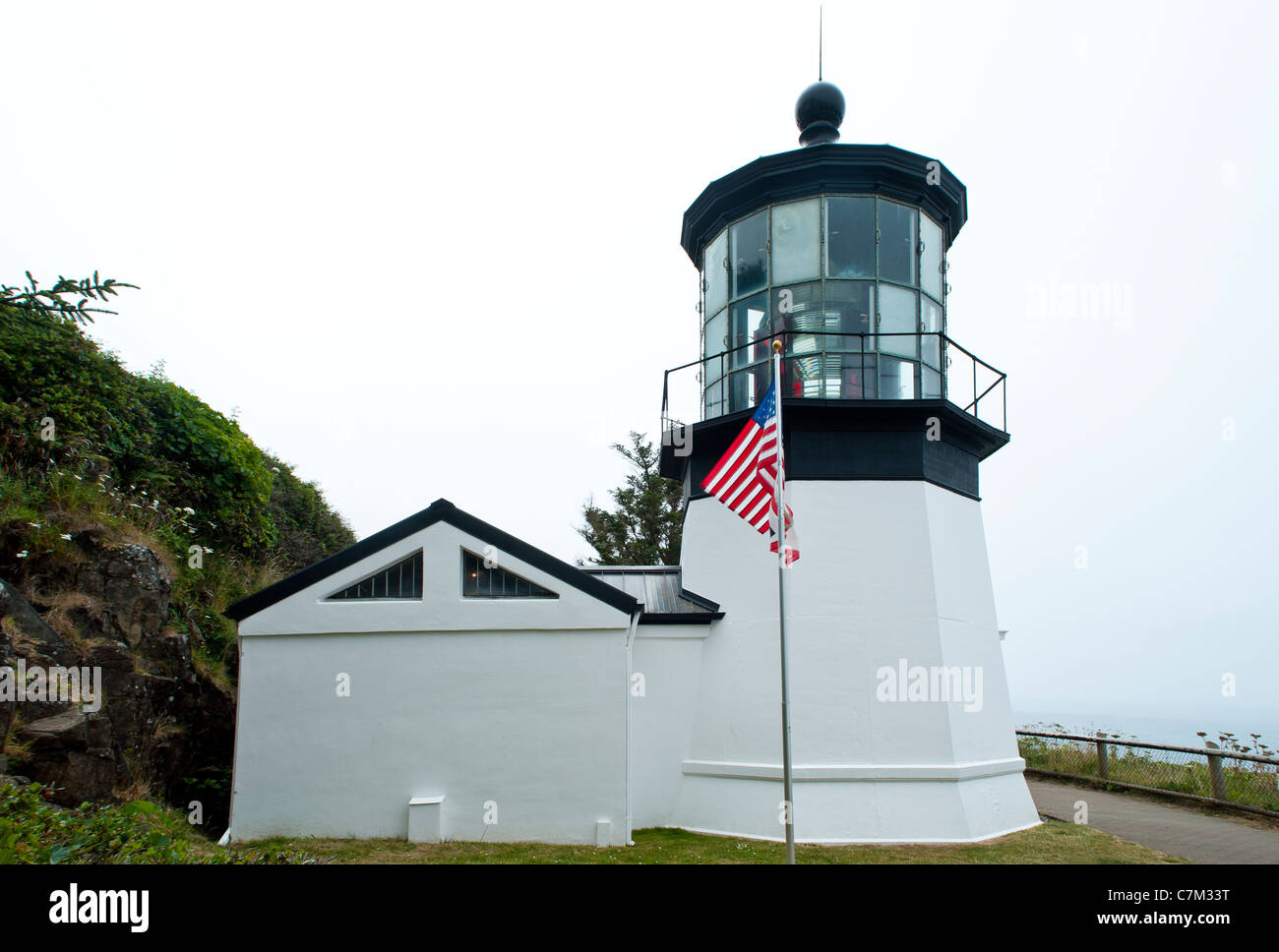 The Cape Meares Light is an inactive lighthouse on the coast of Oregon. It is located on Cape Meares just south of Tillamook Bay Stock Photo