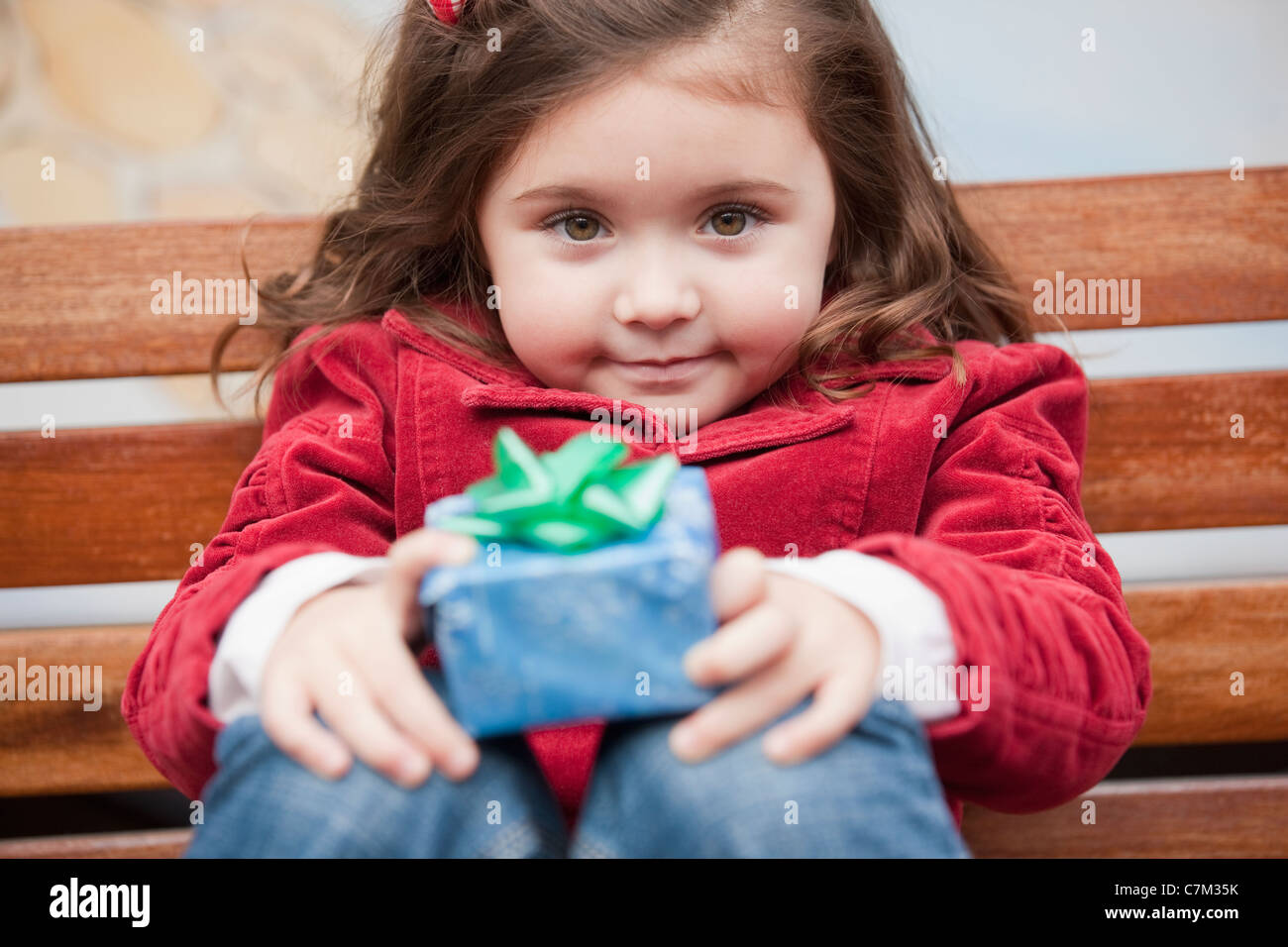 Portrait of a girl holding a Christmas gift Stock Photo
