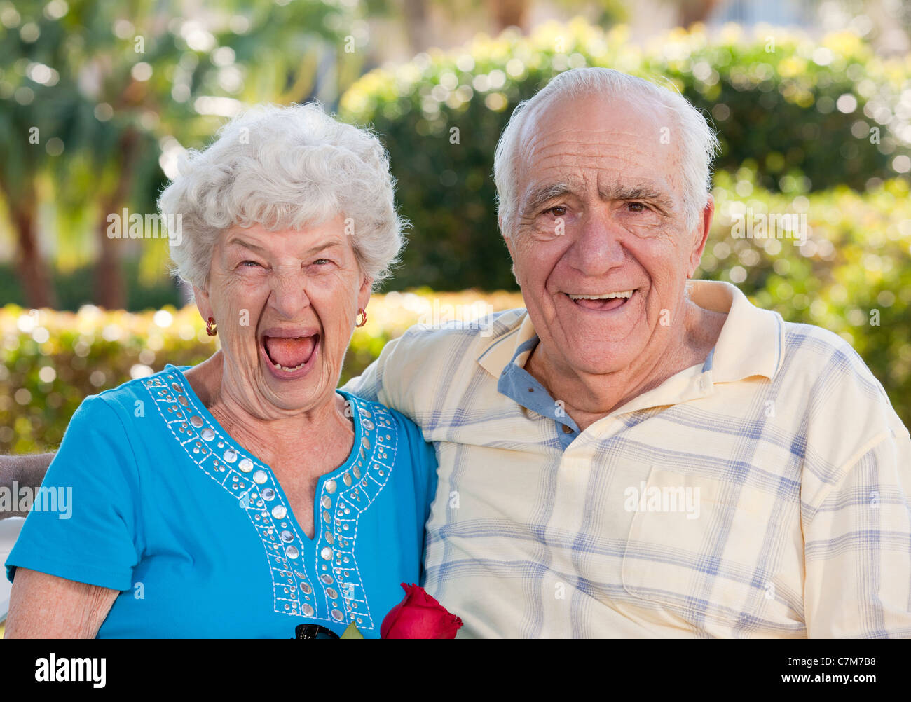 Couple smiling in a park Stock Photo - Alamy