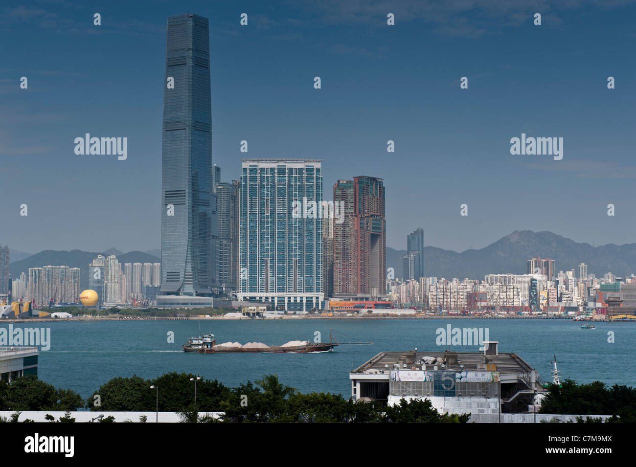 View on the Kowloon side from Hong Kong Island with the ICC, International Commerce Centre as the highest building. Stock Photo