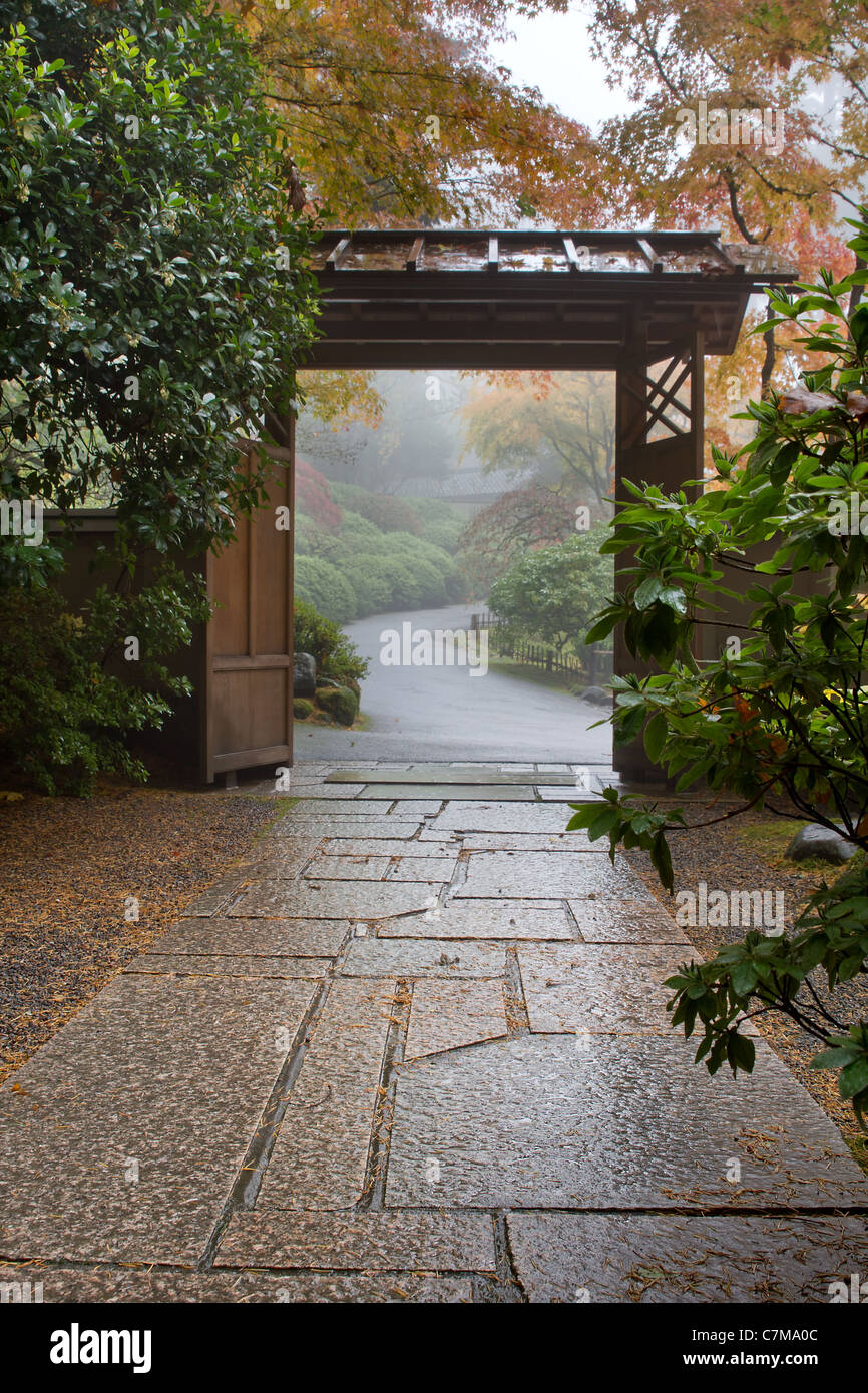 Stone Path in Japanese Garden Foggy Morning in Fall Stock Photo