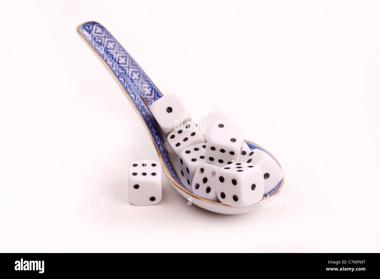 Chinese spoon with character dices over white Stock Photo