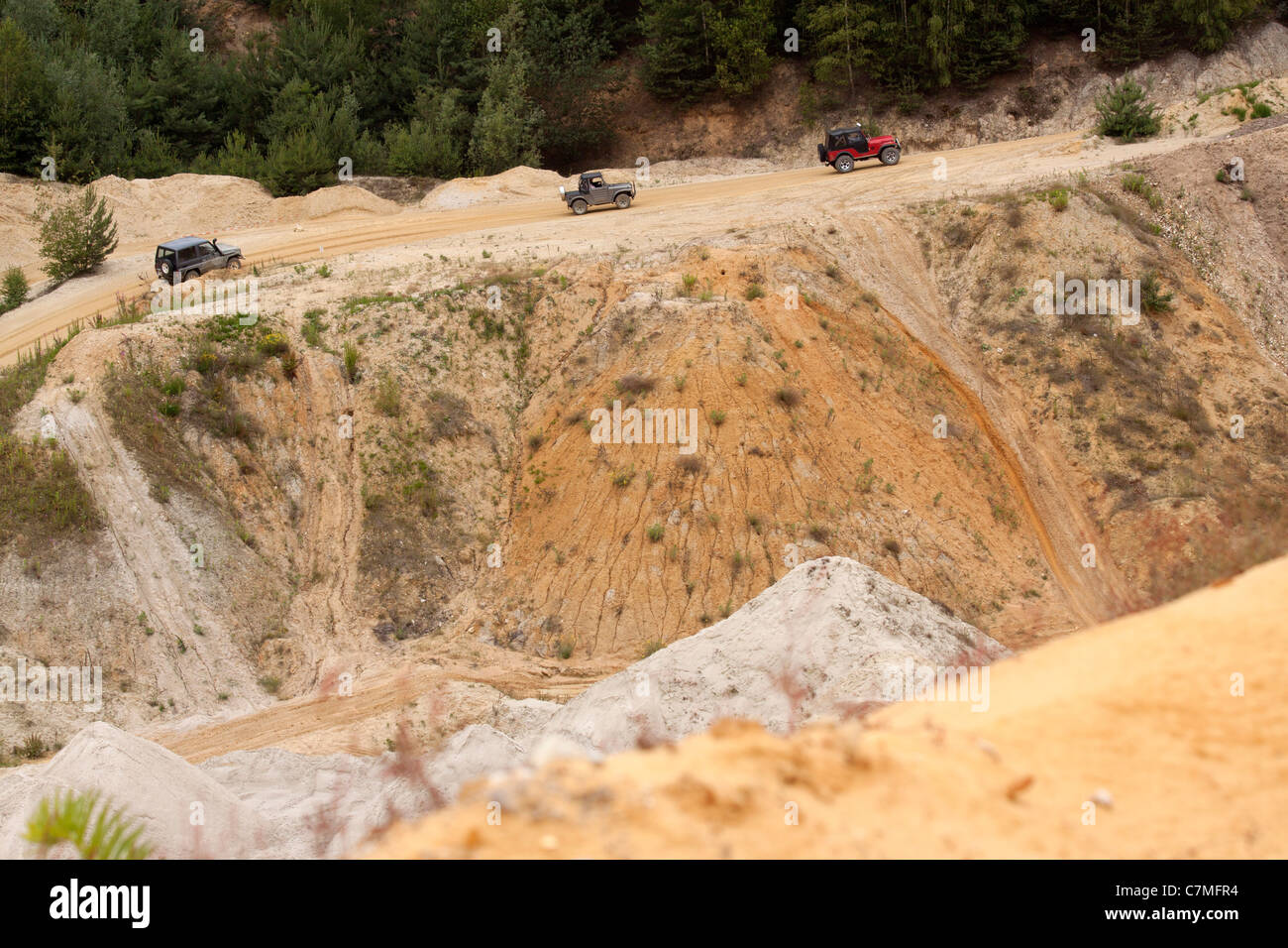 four wheel cars driving in a sand pit Stock Photo - Alamy