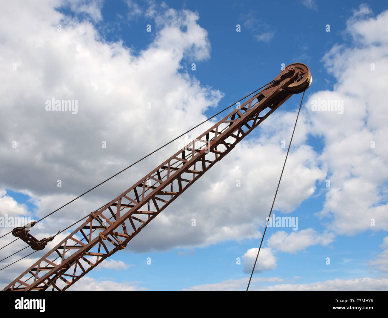 Silhouette of a crane boom against a cloudy sky Stock Photo - Alamy