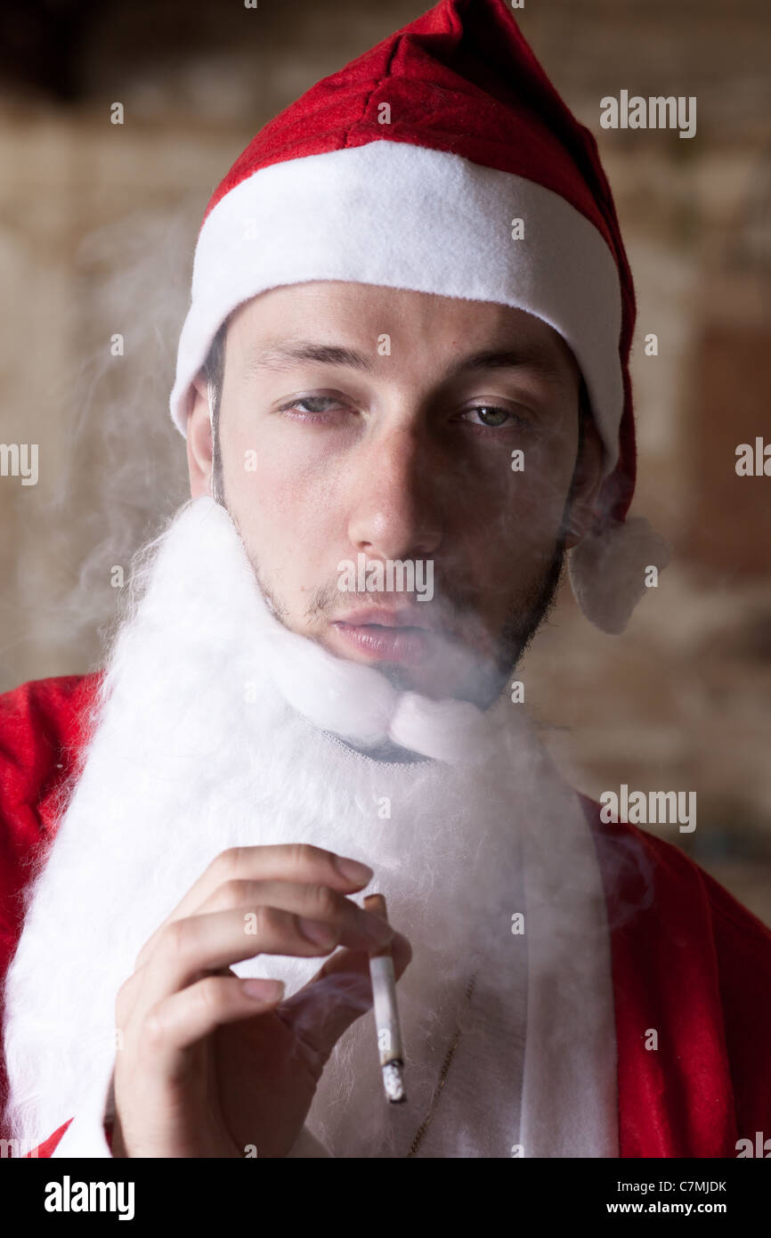 bad santa cigarette Bad Santa Smoking a Cigarette Stock Photo