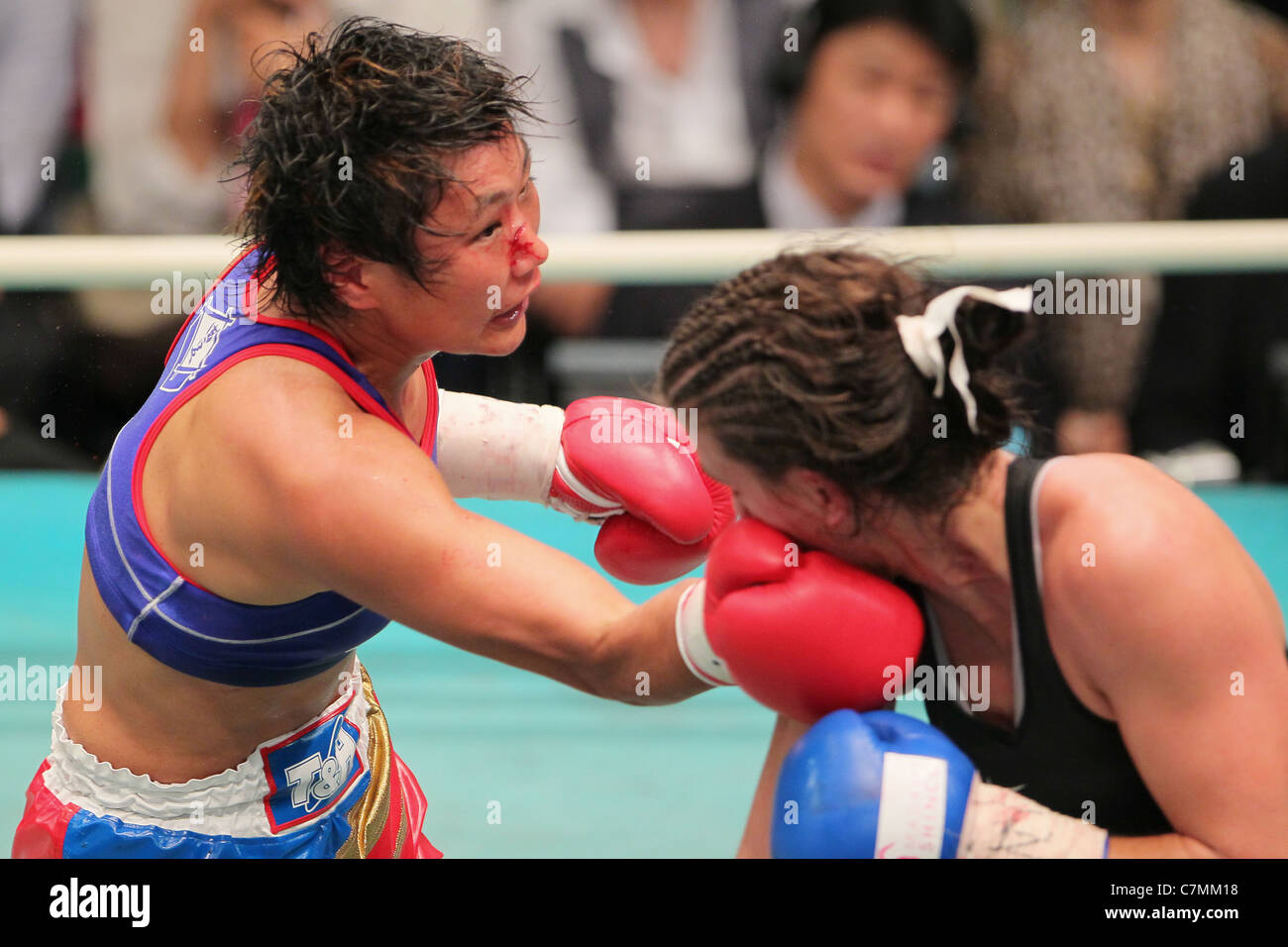 Fujin Raika (JPN) and Jelena Mrdjenovich (CAN) fight during the 2011 WBA Female Minimum weight . Stock Photo