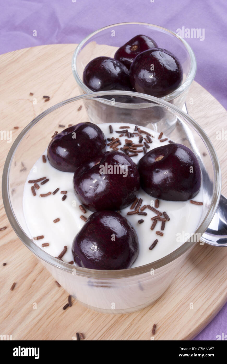 yogurt with fresh sweet cherries and chocolate sprinkles Stock Photo