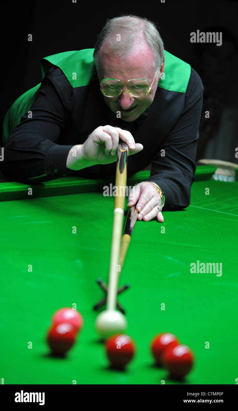 UK, Dennis Taylor, former World Snooker Champion and BBC commentator playing a set of exhibition games Stock Photo