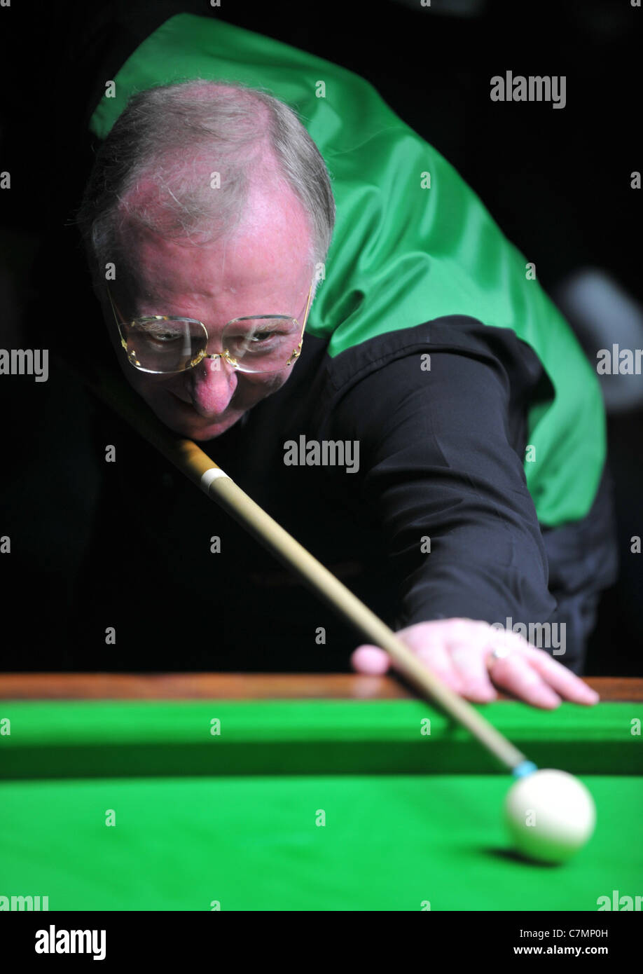 UK, Dennis Taylor, former World Snooker Champion and BBC commentator playing a set of exhibition games Stock Photo