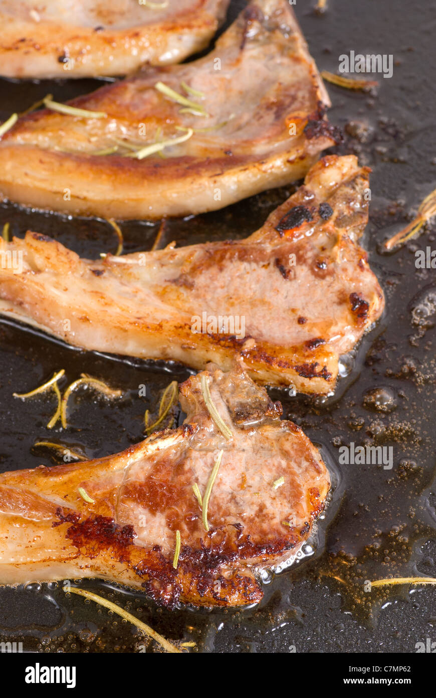 Crunchy lamb chops being cooked on a griddle Stock Photo Alamy