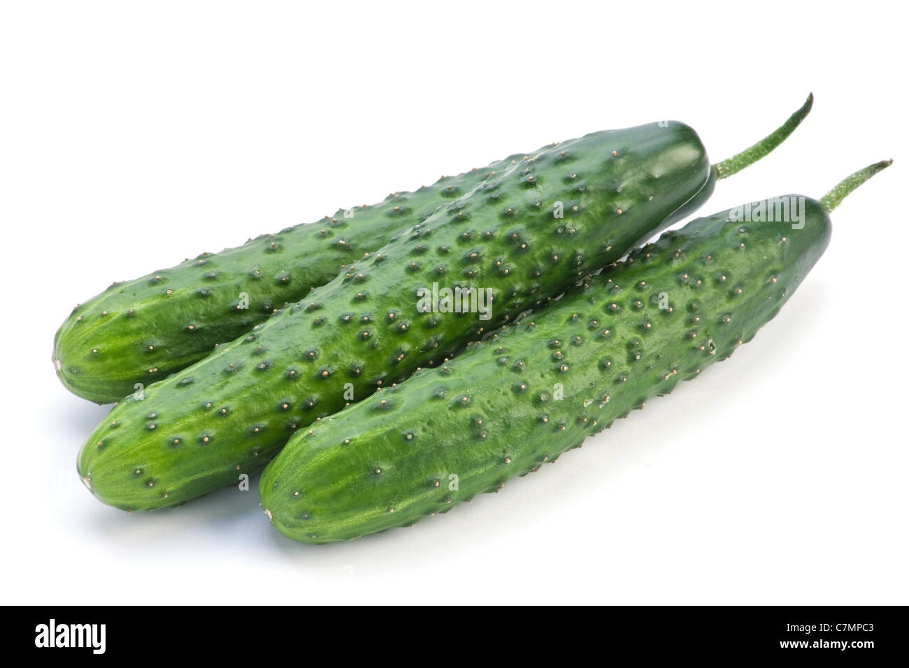 Green long cucumber fresh vegetable isolated on white Stock Photo