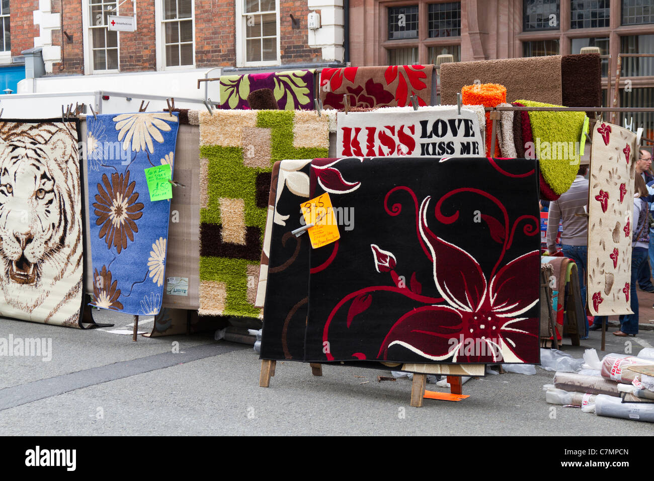 Market stall selling rugs mats hires stock photography and images Alamy