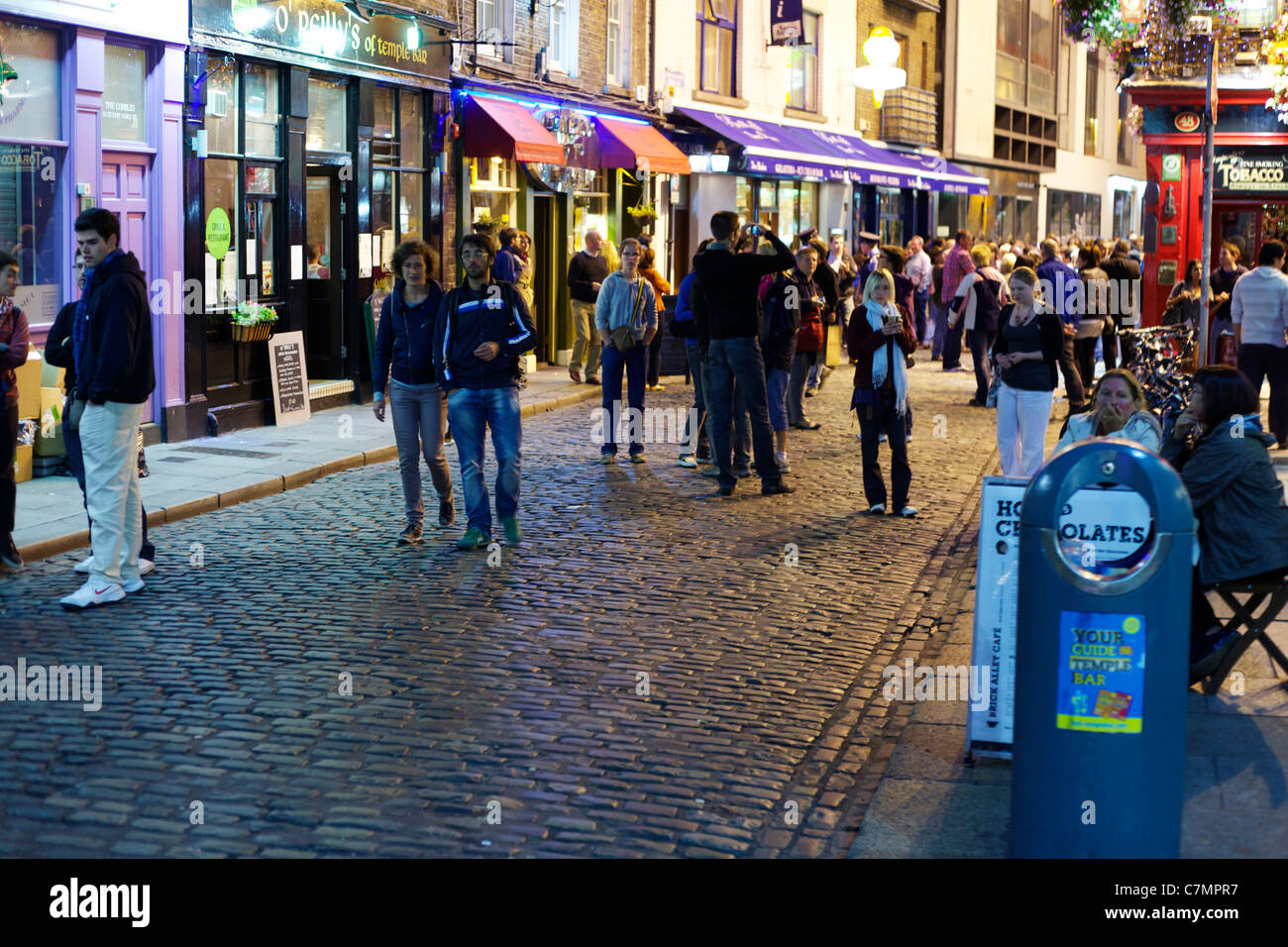 People walking in Temple Bar area of Dublin at night Stock Photo