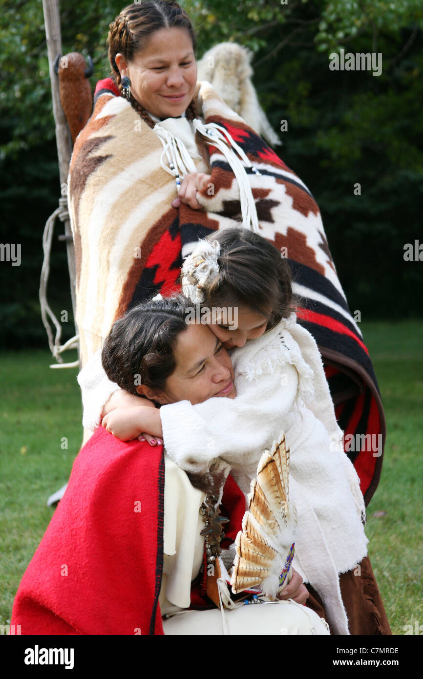 Native American Indian family mom and daughter hug Stock Photo