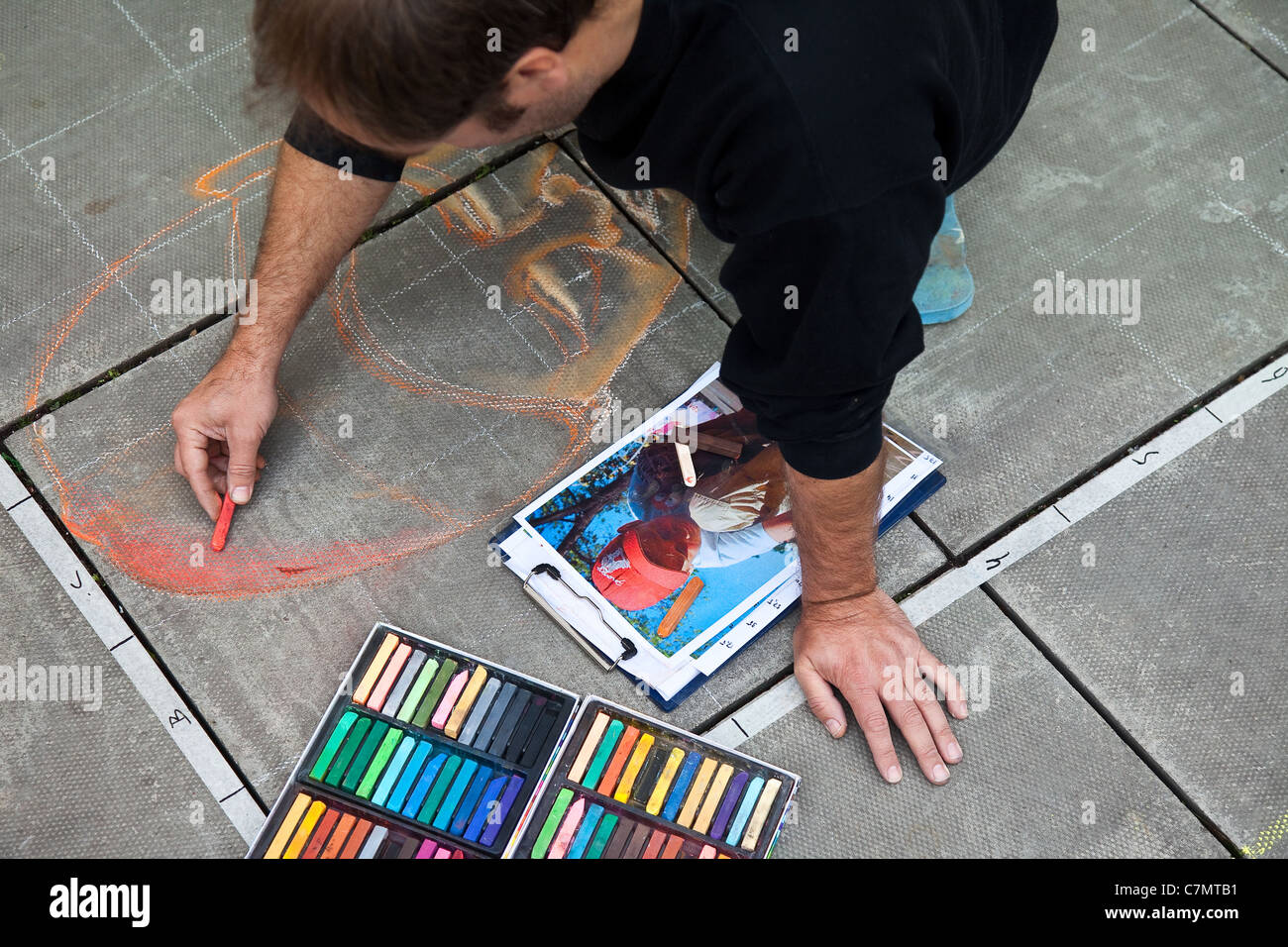 Chalk drawings on pavement surfaces, sidewalk chalk art, stencils