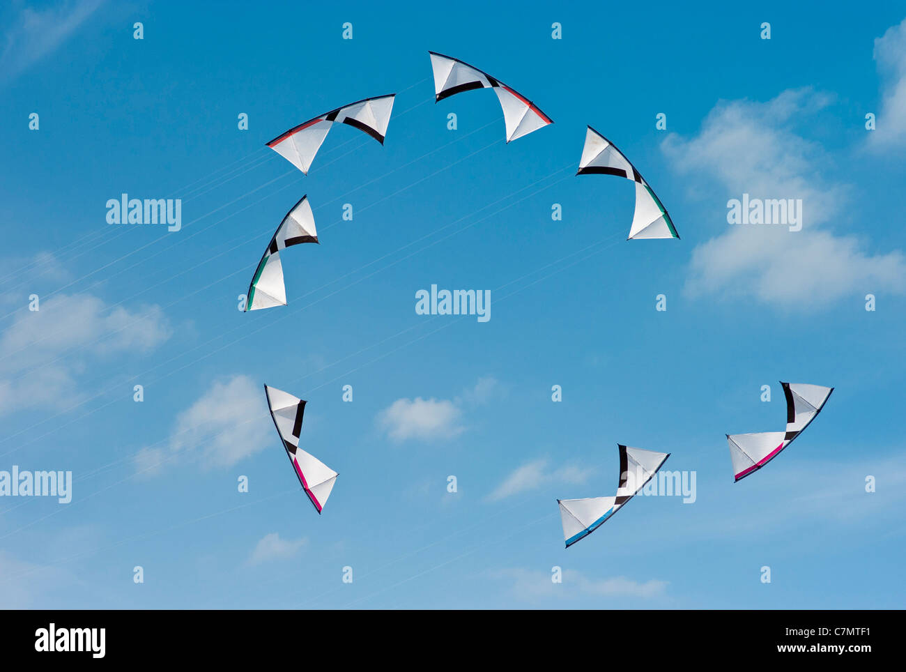 Precision or Formation Kite Flying by a group of People, Teamwork. Stock Photo