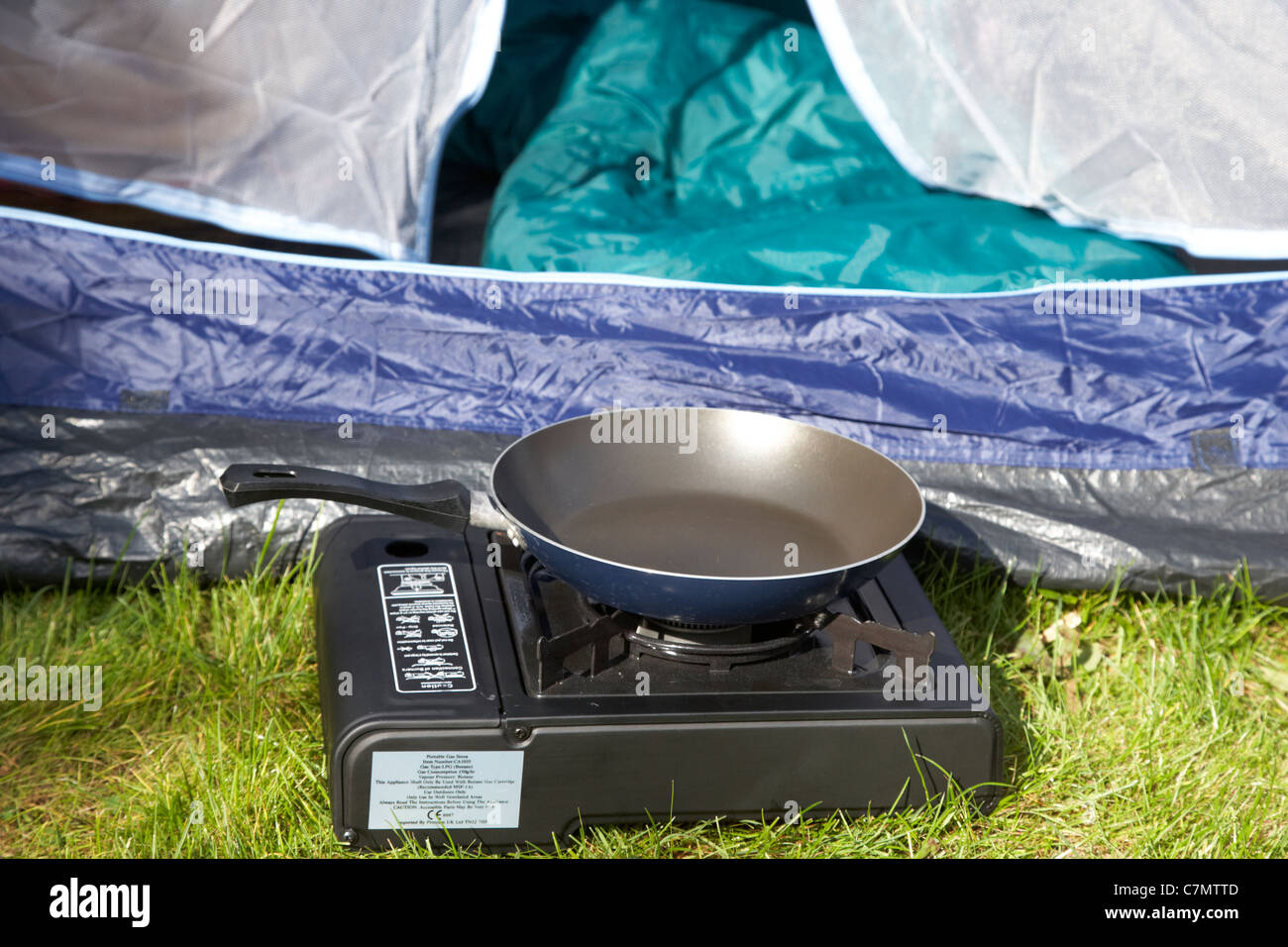 Camping gaz cooker (steel and plastic), gas cylinder (pressed steel) and  camping saucepans (aluminium and plastic Stock Photo - Alamy