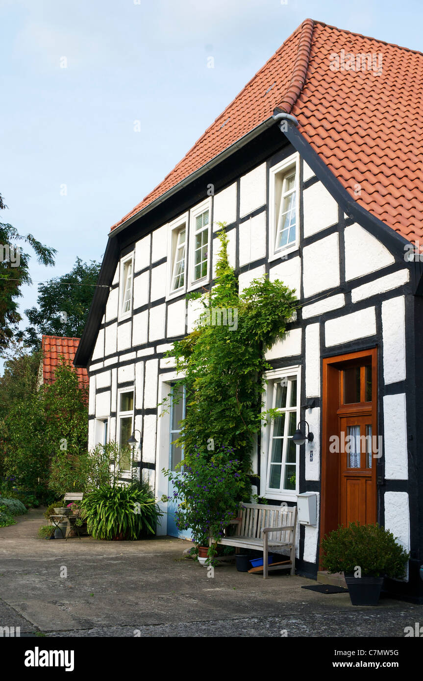 Old timber frame farm house in Petershagen. Stock Photo
