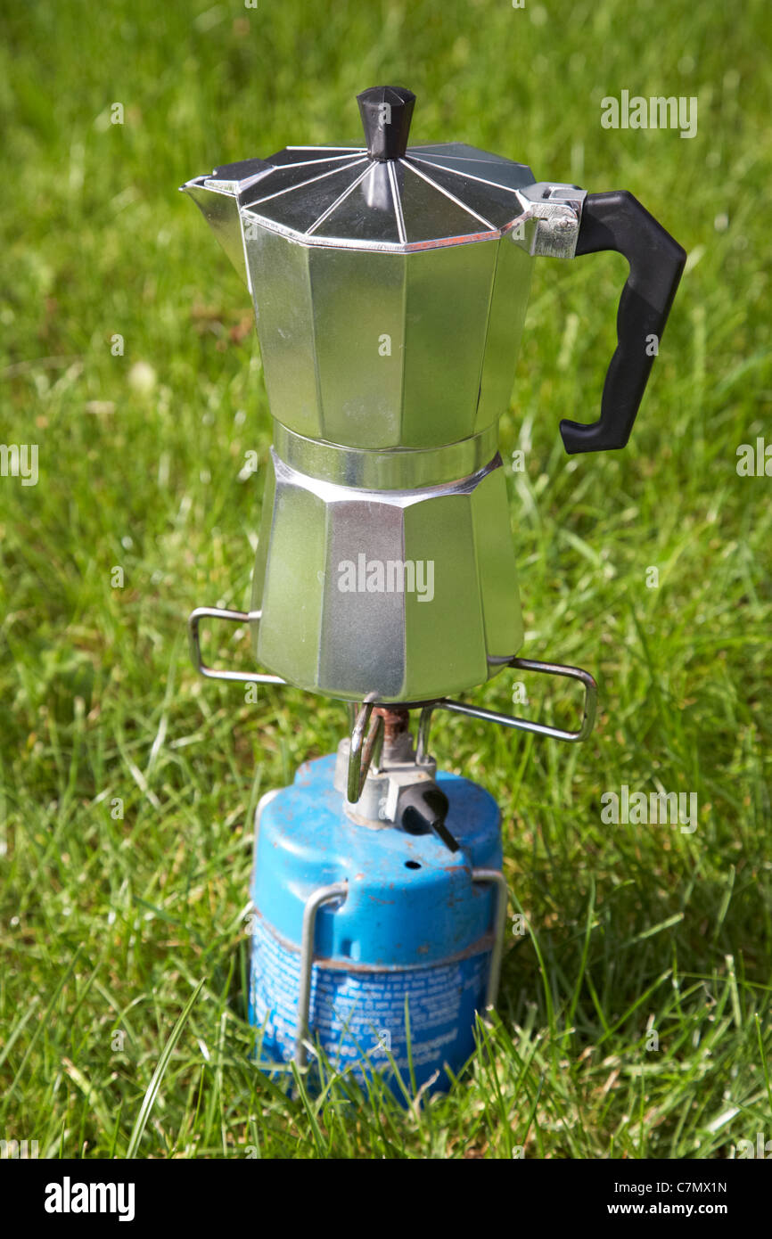 gourmet coffee percolator precariously balanced on a gas camping