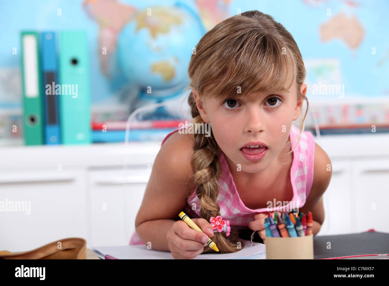 Little girl drawing with crayons Stock Photo - Alamy
