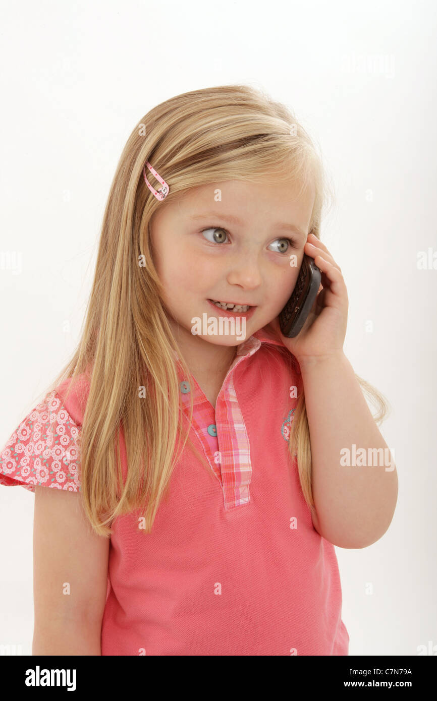 Young child using a blackberry smart phone. Stock Photo