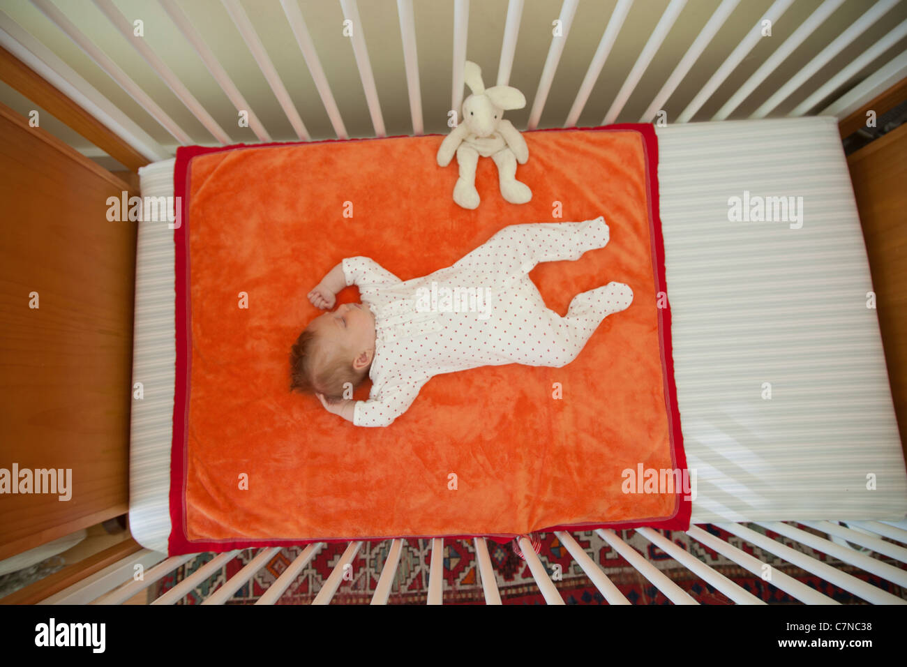 baby sleeping in a crib Stock Photo Alamy