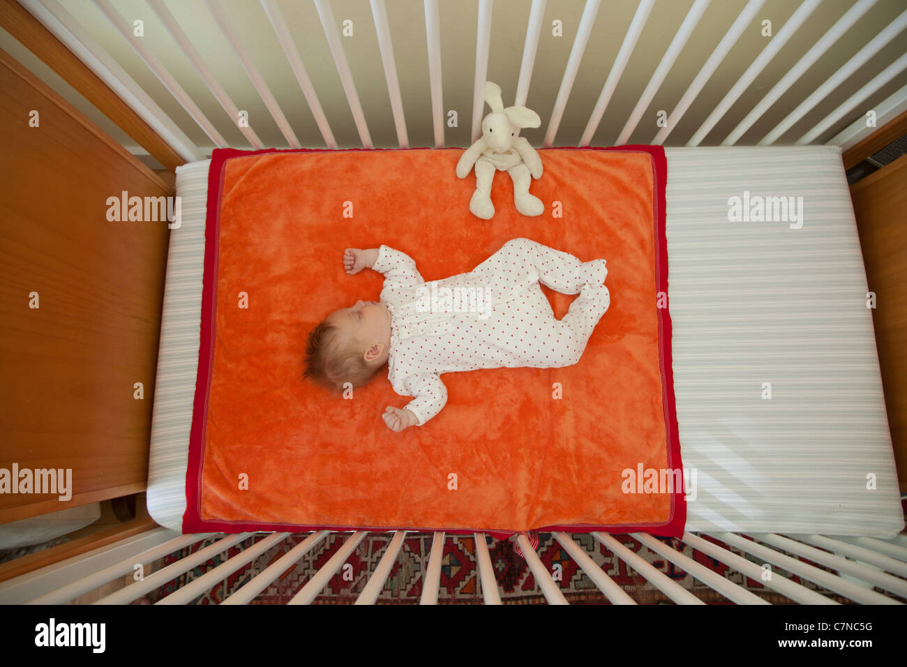baby sleeping in a crib Stock Photo Alamy