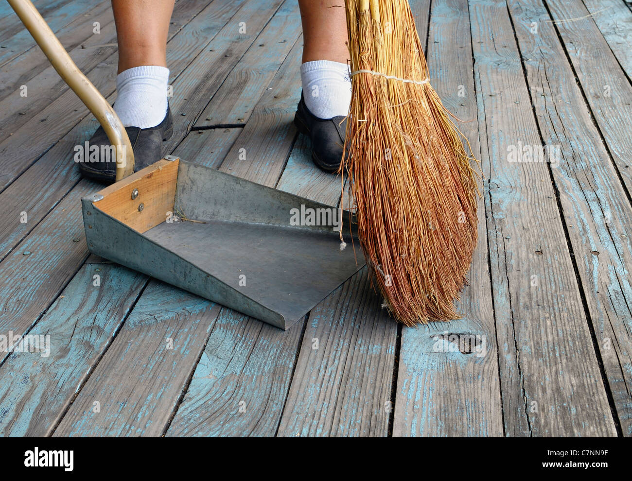 Sweeping with Broom Into Dustpan Stock Photo Alamy