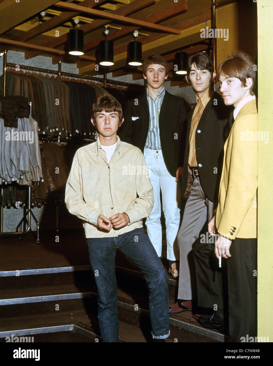 SMALL FACES UK group in a Carnaby Street boutique in 1966. From left: Ronnie Lane, Kenny Jones, Ian McLagan, Steve Marriott Stock Photo