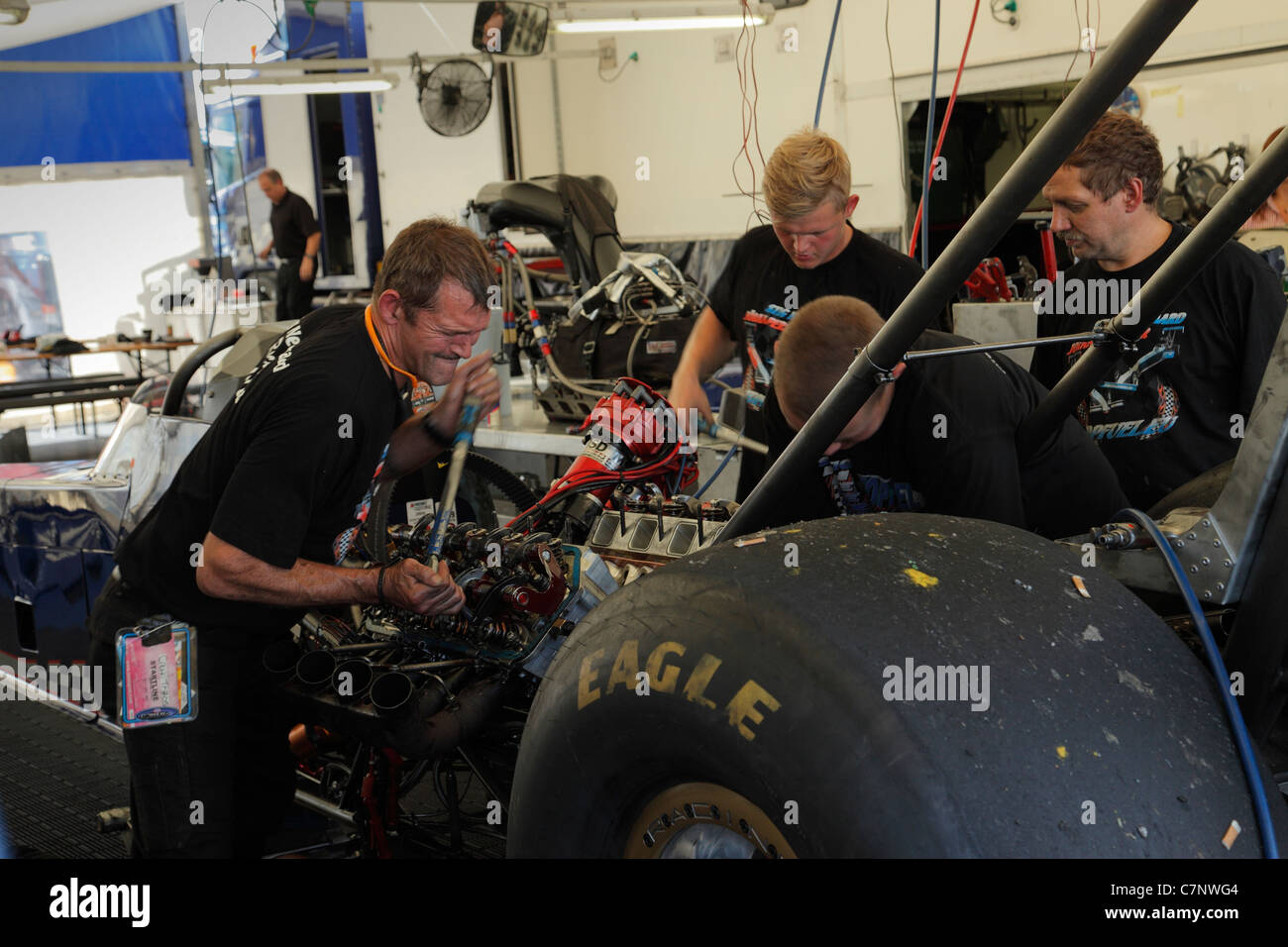 Mechanics working on a top fuel dragster. Stock Photo