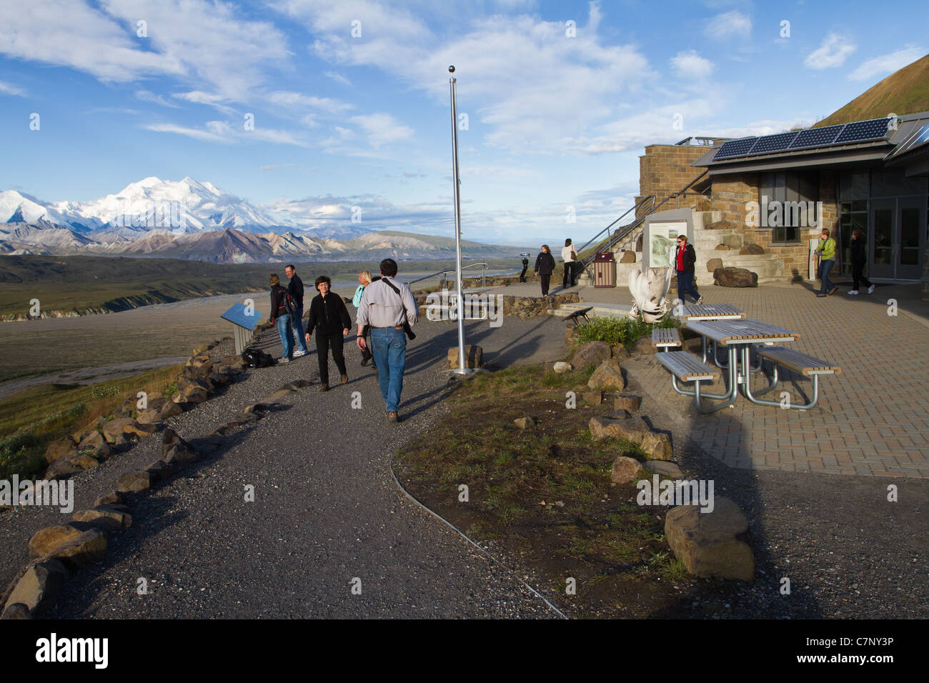 Tourists enjoy a sunny morning at Eielson Visitor Center with Denali (Mt. McKinley) in the background, Denali National Park, AK. Stock Photo