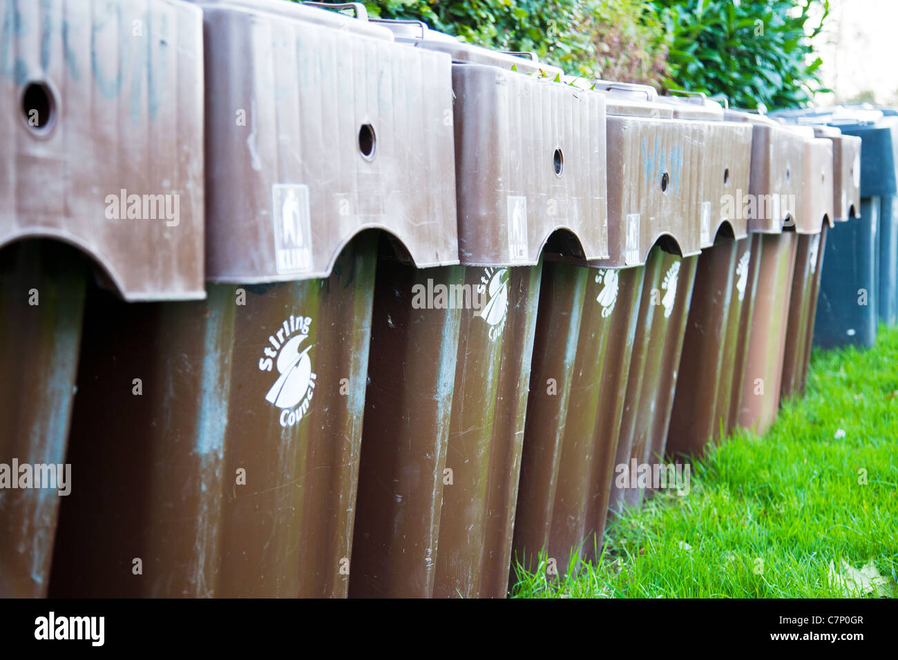 Stirling council wheelie bins for waste and recycling rubbish brown bin row line lined up for