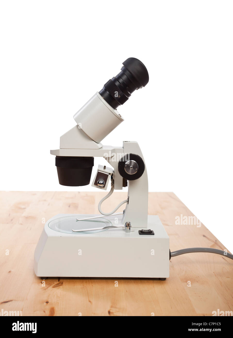 stereo microscope close up on wooden desk Stock Photo Alamy