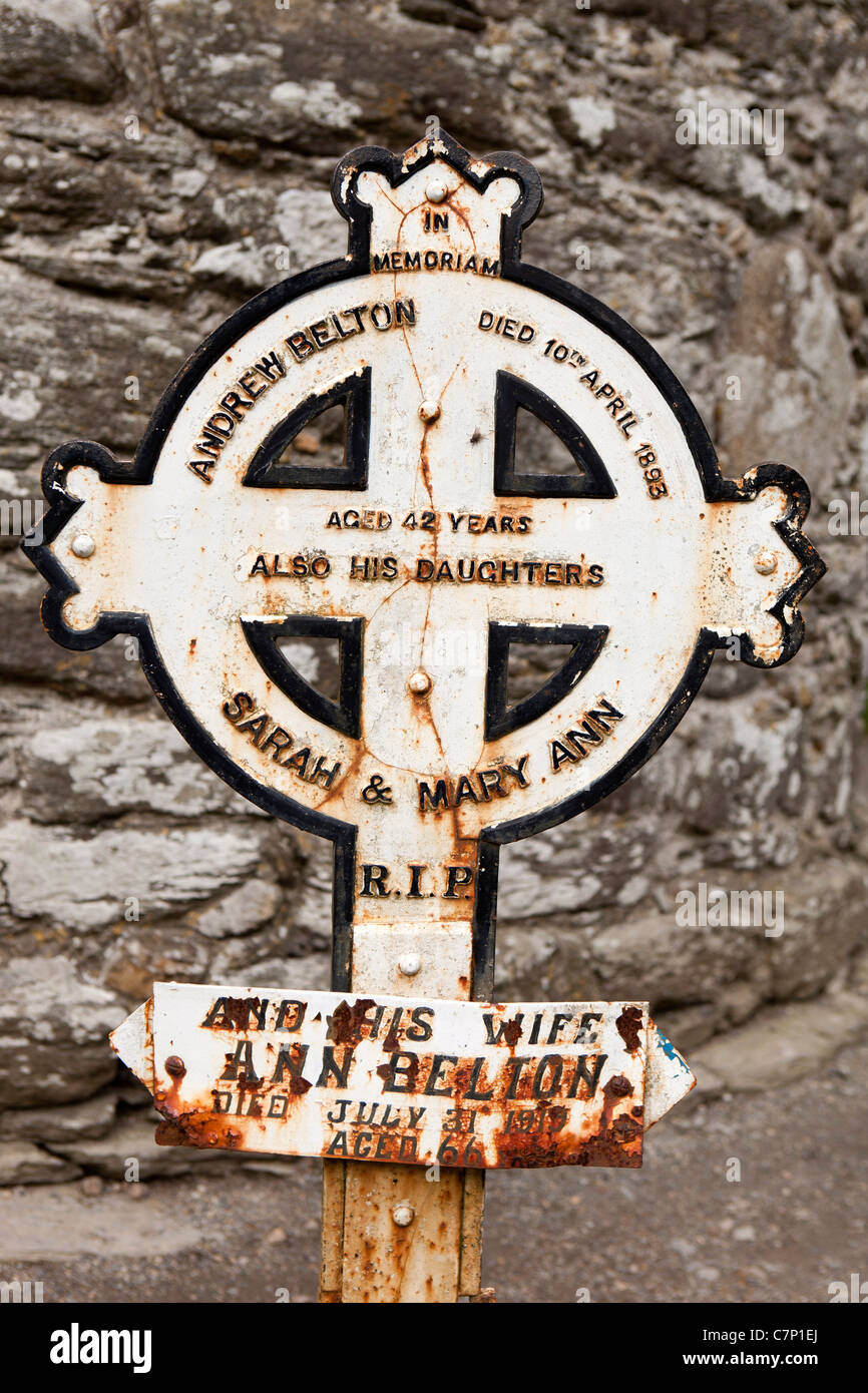 Ireland, Co Wicklow, Glendalough, historic monastic site, 1893 cast iron Celtic cross grave headstone of Andrew Belton daughters Stock Photo