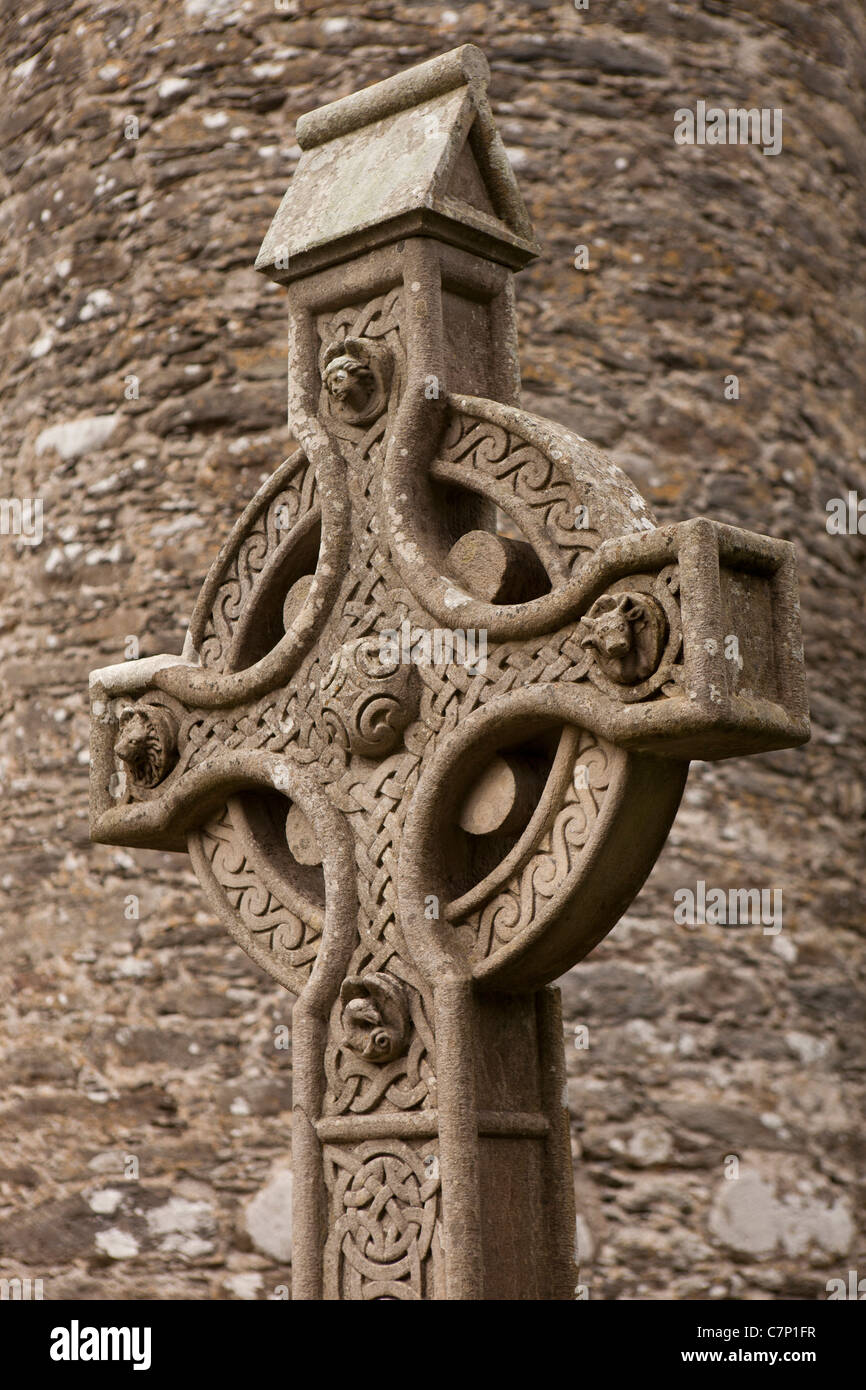 Ireland, Co Wicklow, Glendalough, historic monastic site, ornately carved stone Celtic cross grave headstone Stock Photo