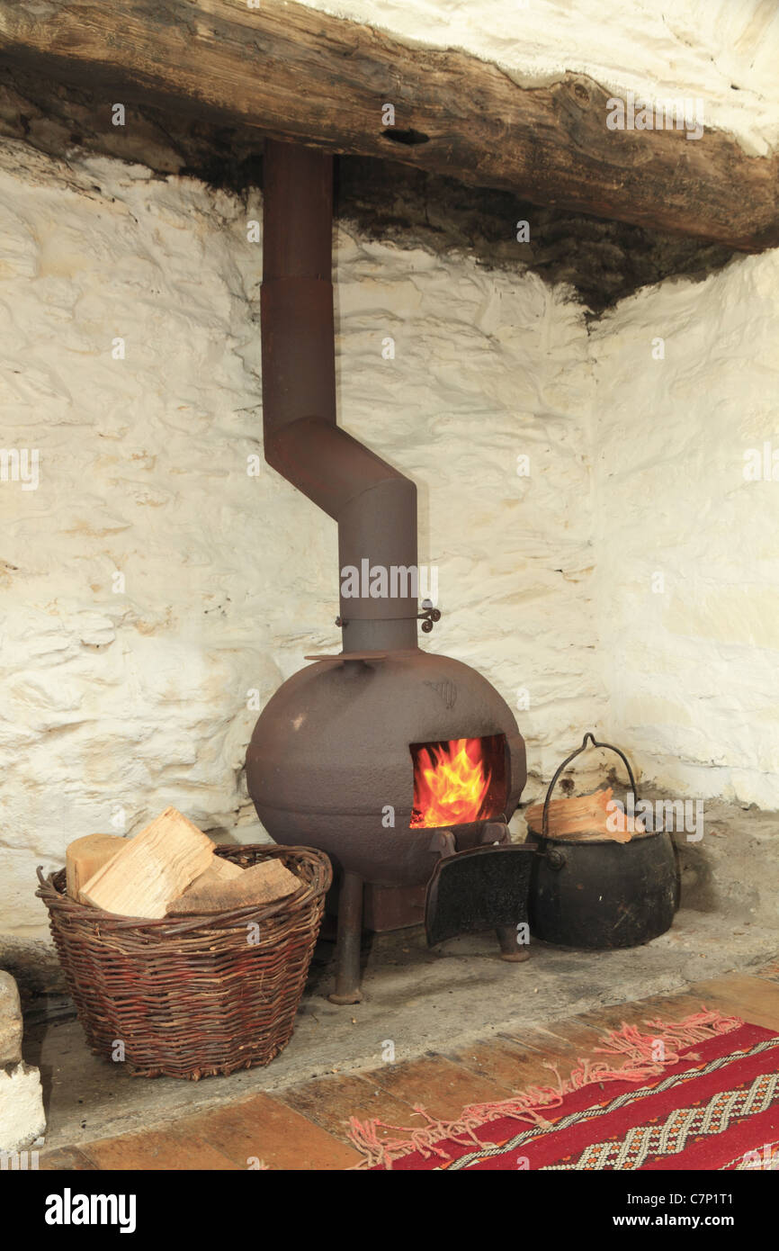 A pot bellied stove in a traditional Irish fireplace, County Kerry, Rep. of Ireland Stock Photo