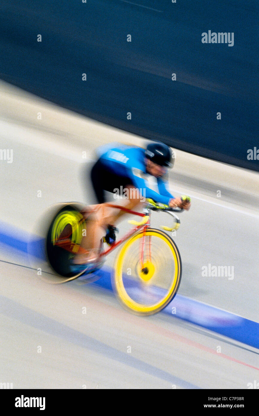 Blurred action of cyclist racing on the velodrome Stock Photo, Royalty ...