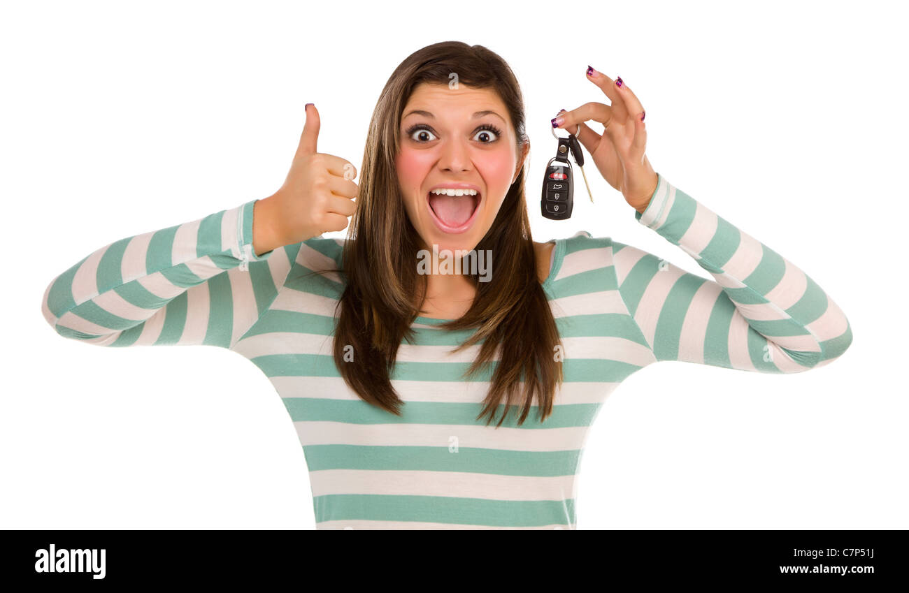 Pretty Ethnic Female with New Car Keys and Thumbs Up Isolated on a White Background. Stock Photo