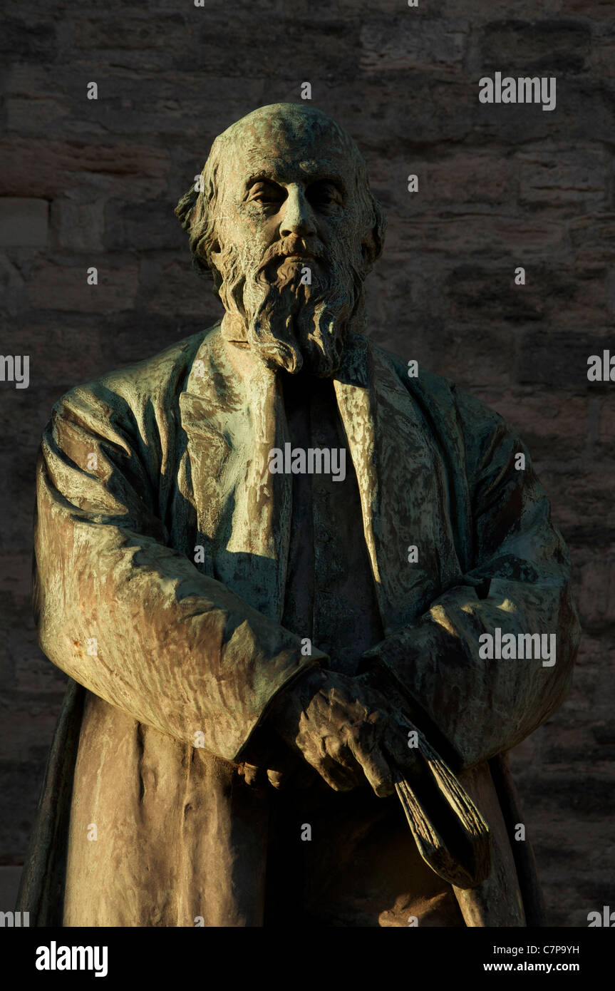 Evening sunshine falls on a statue of the poet William Barnes, known mainly for his poetry in the Dorset dialect. Dorchester, England, United Kingdom. Stock Photo