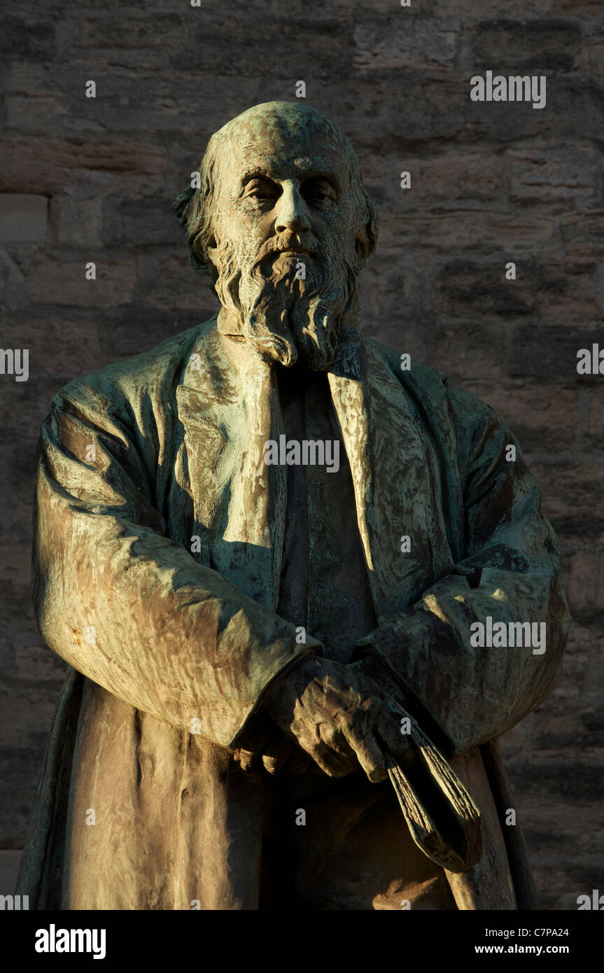 Evening sunshine falls on a statue of the poet William Barnes, known mainly for his poetry in the Dorset dialect. Dorchester, England, United Kingdom. Stock Photo