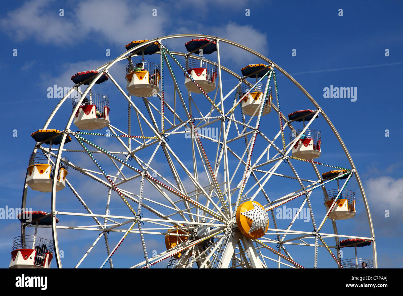 Ferris wheel with open gondolas on a funfair Stock Photo Alamy