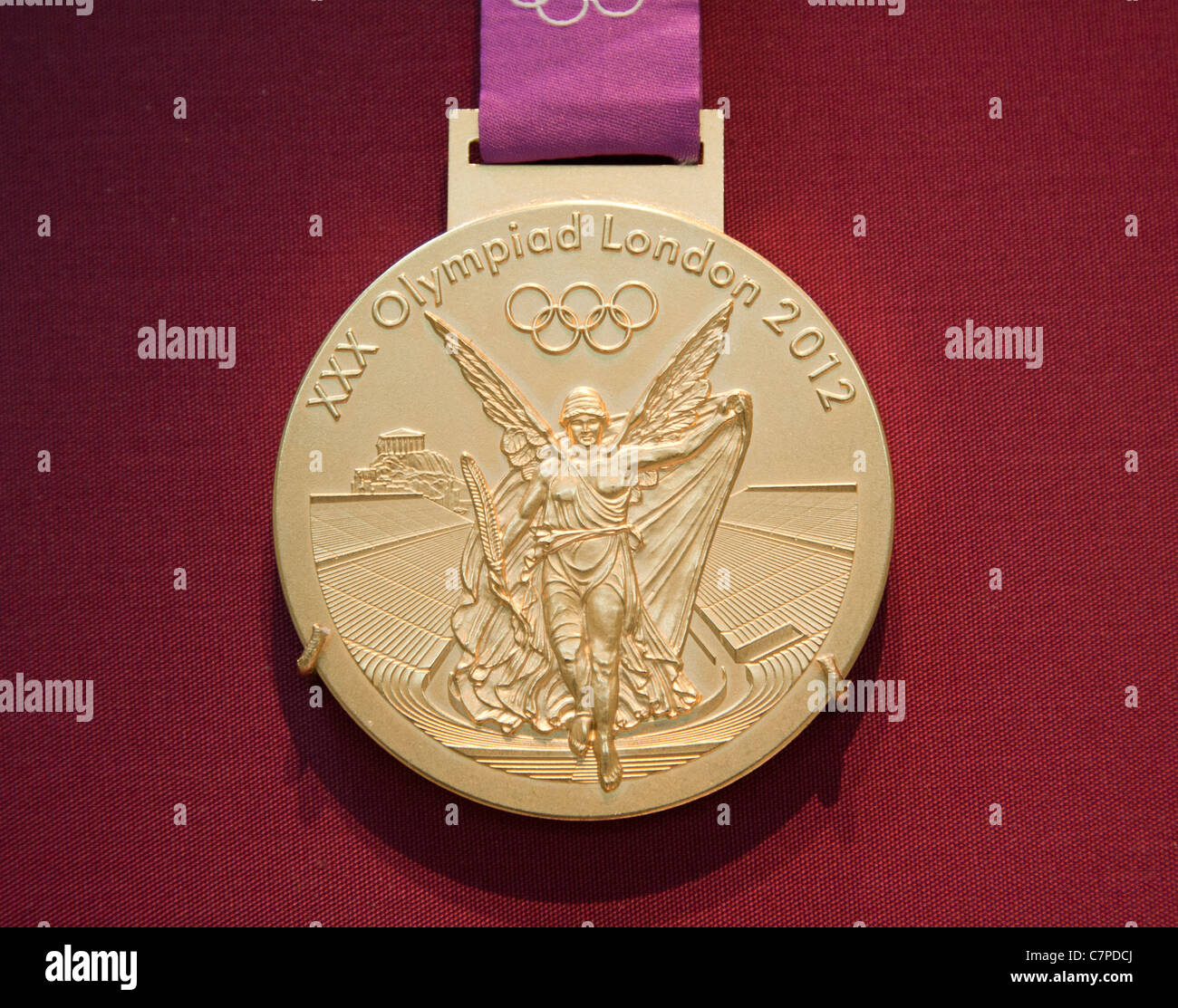 The 2012 Olympic Games Gold Medal on display in the British Museum in London Stock Photo