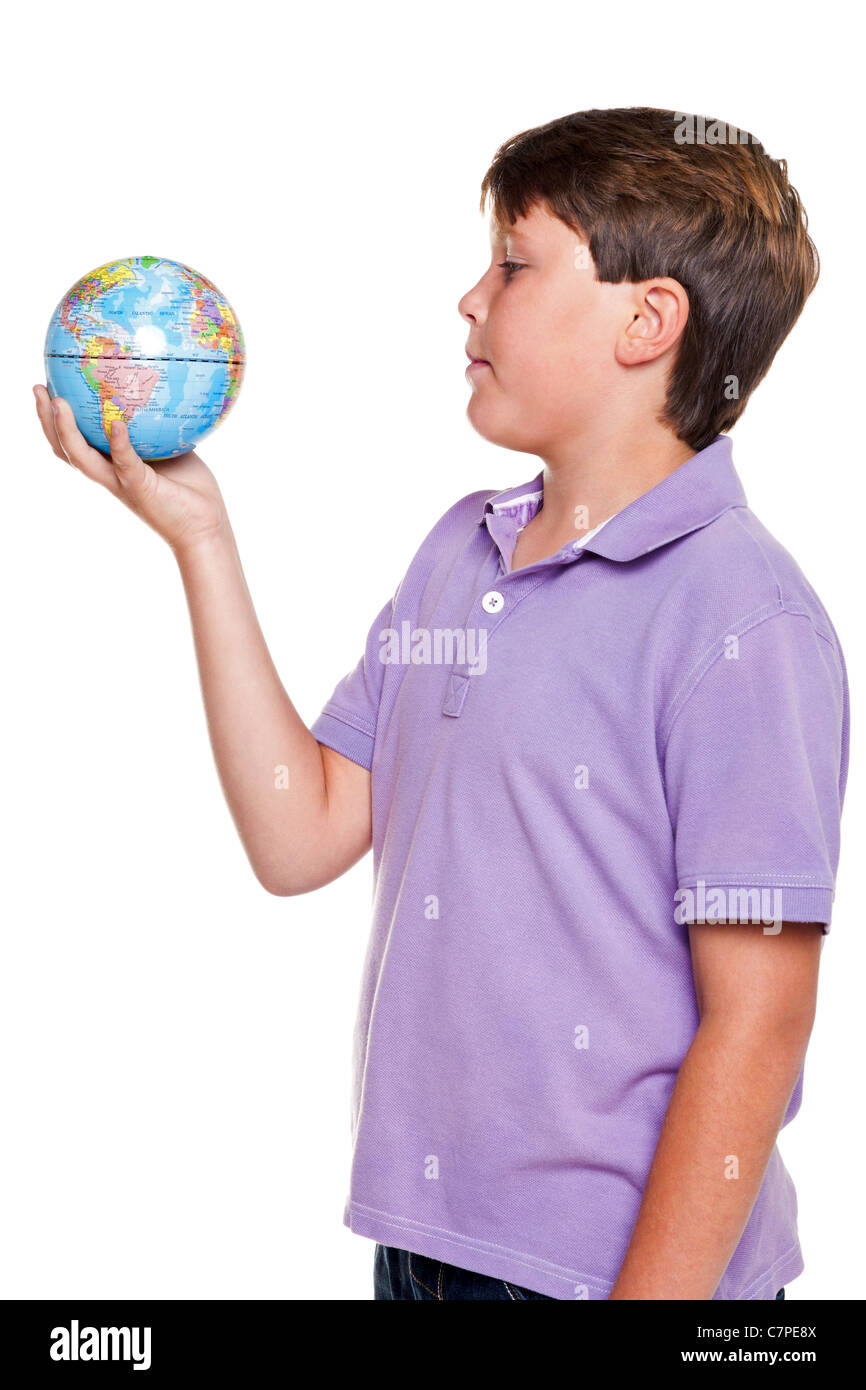 Photo of an 11 year old school boy holding a world globe, isolated on a white background. Stock Photo