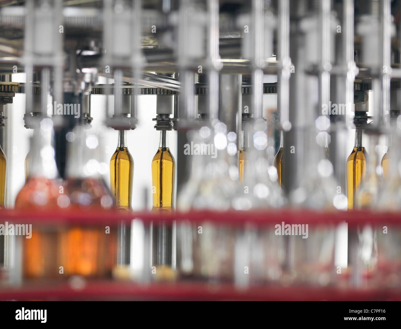 Wine bottles in bottling machine Stock Photo