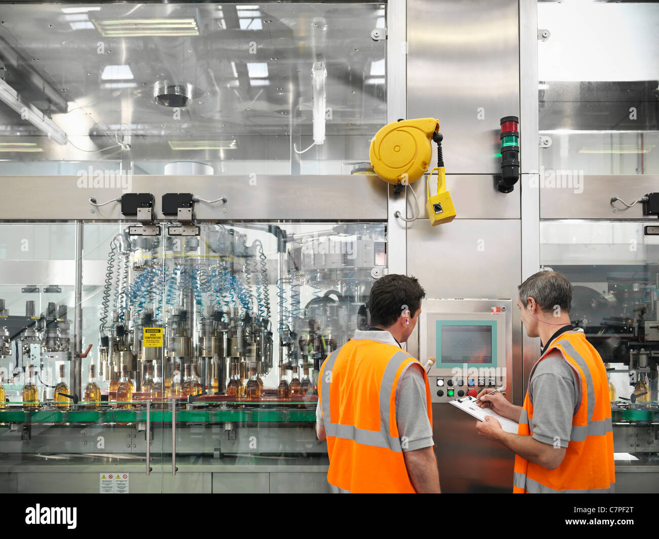 Factory workers in bottling plant Stock Photo