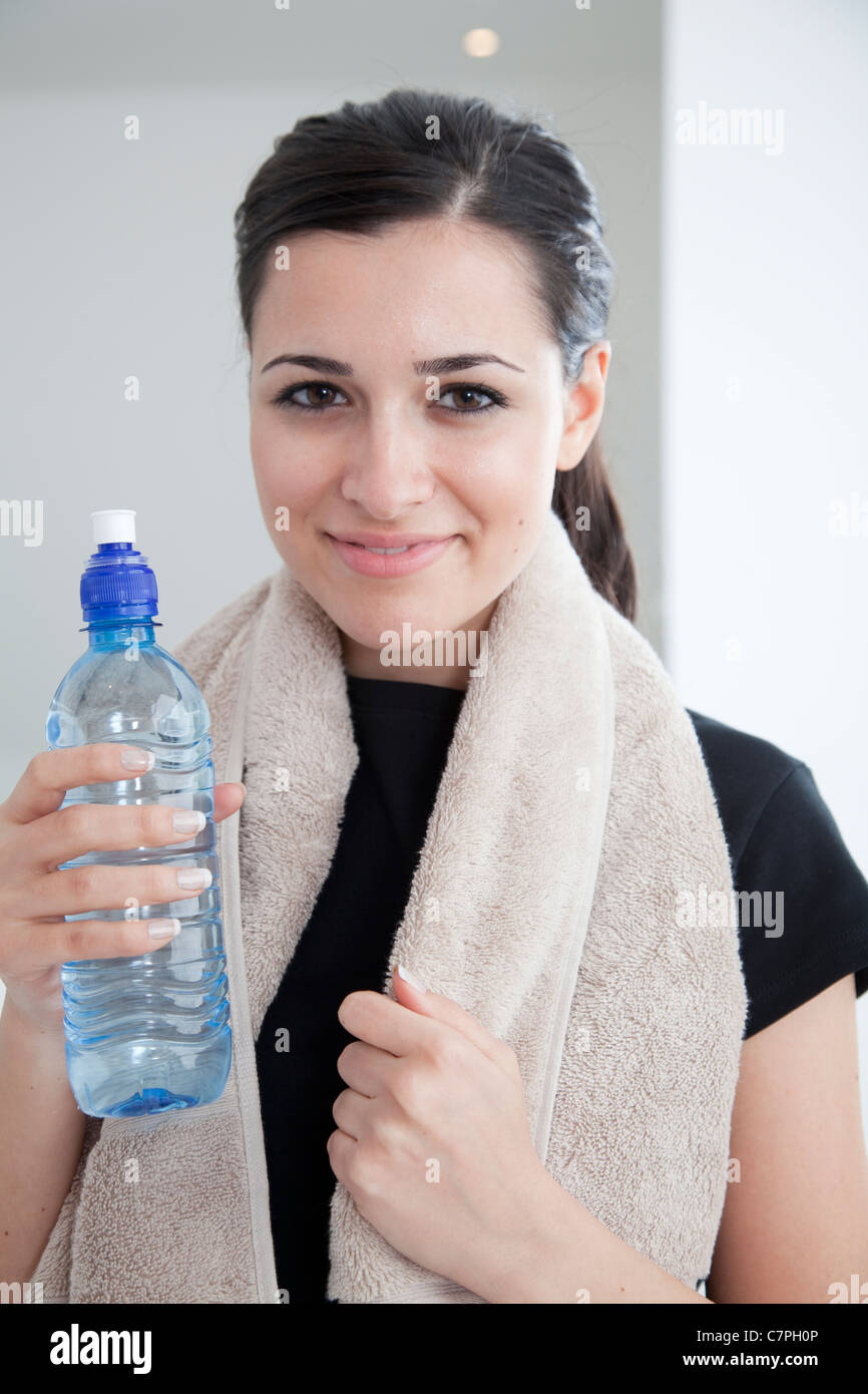 Woman drinking water after workout Stock Photo Alamy
