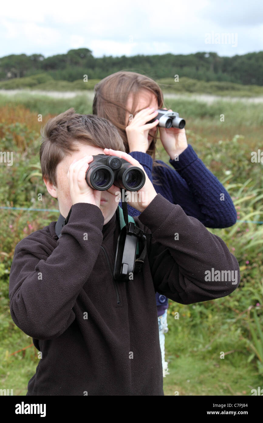 Family birdwatching; Marazion; Cornwall; UK Stock Photo