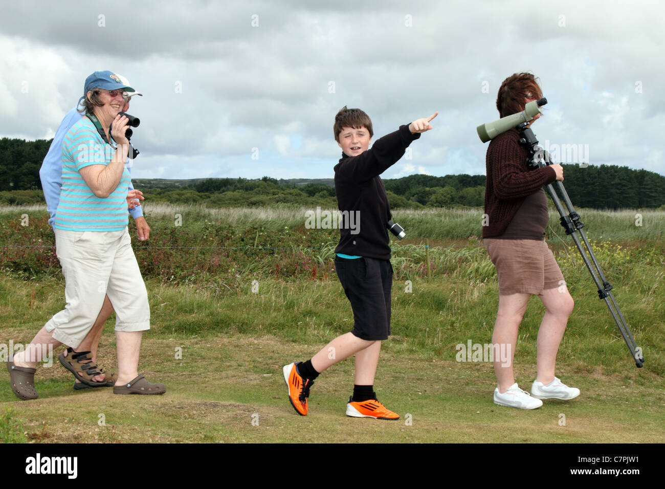 Family birdwatching; Marazion; Cornwall; UK Stock Photo