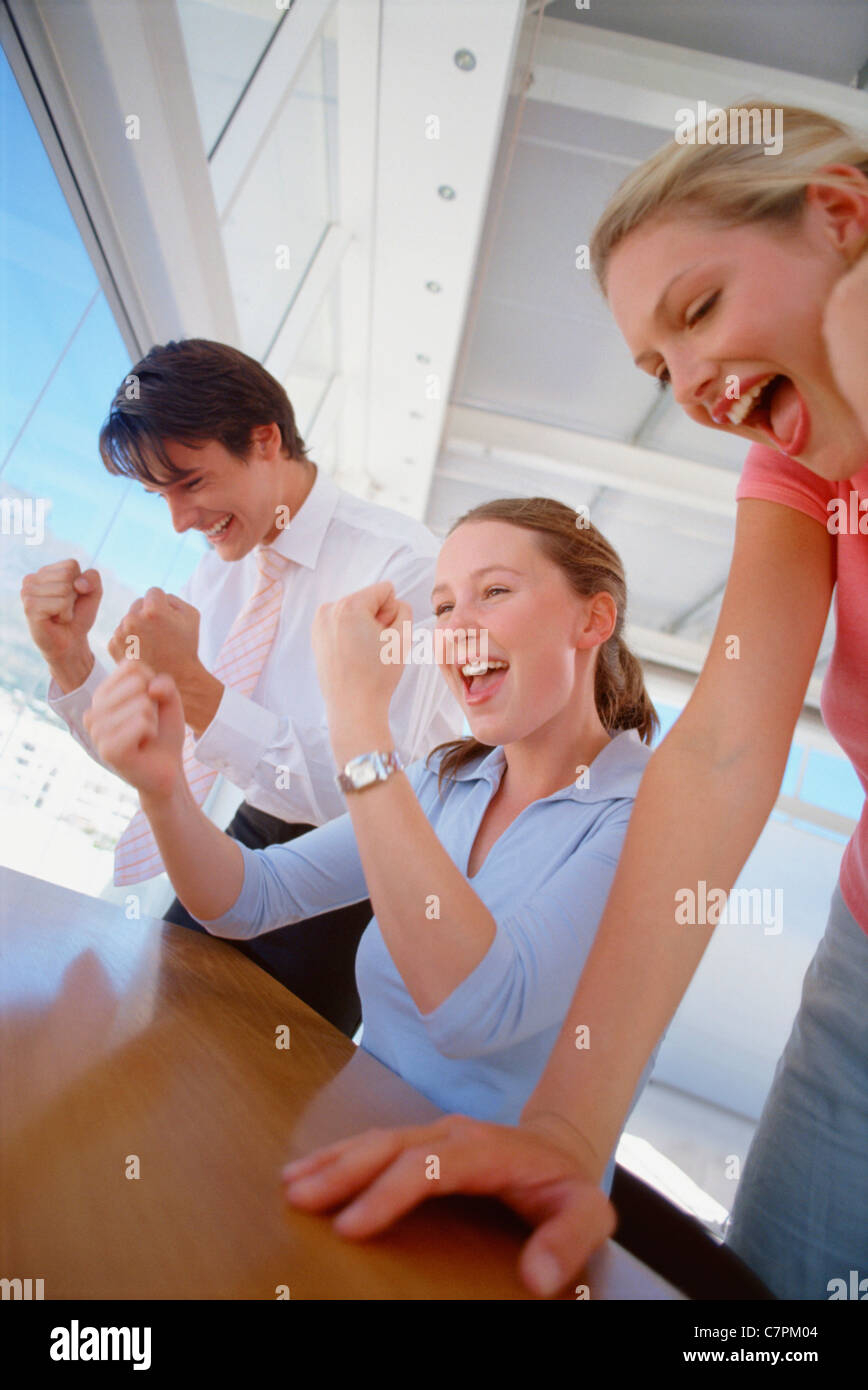 Business people cheering together Stock Photo - Alamy
