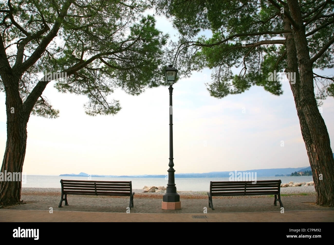 Two benches with a view on Lake Garda in Italy Stock Photo